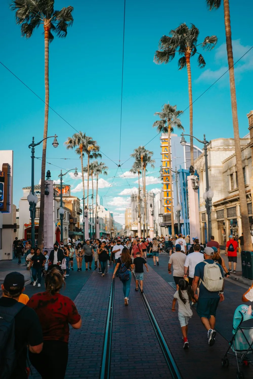 Buena Vista Street at Disney California Adventure with palm trees and vintage Los Angeles storefronts